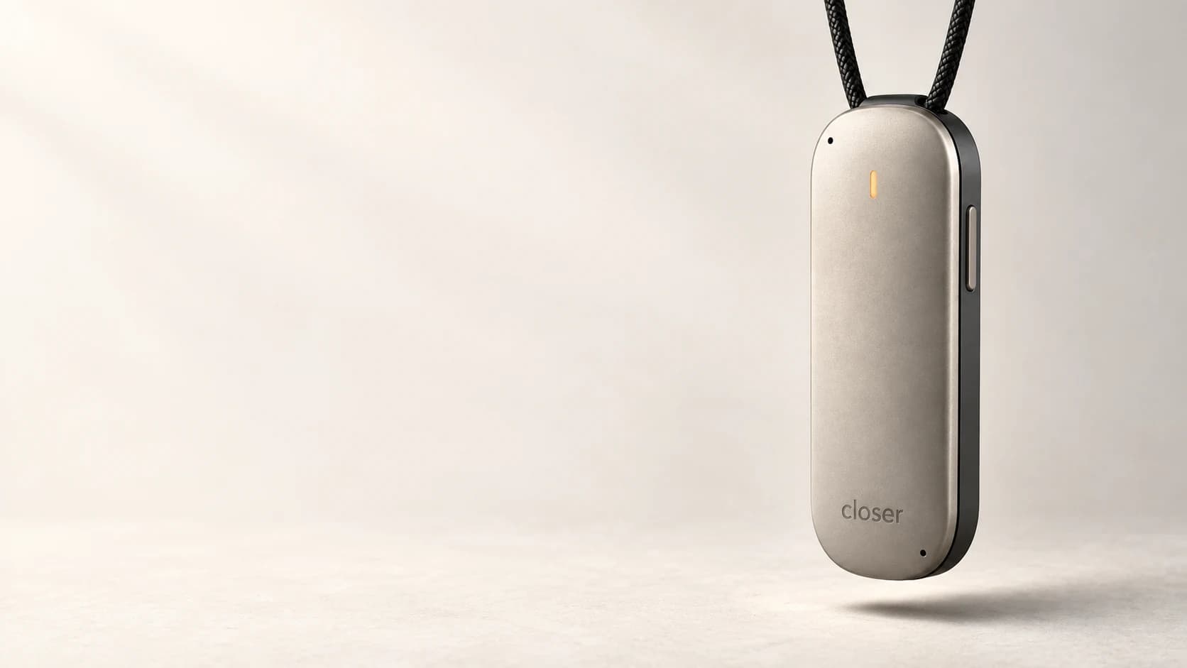 Closer’s slim titanium-colored wearable, with a subtle amber recording light and neck cord